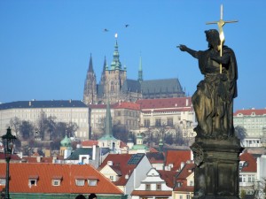 Statue of St. John the Baptist pointing at Prague Castle